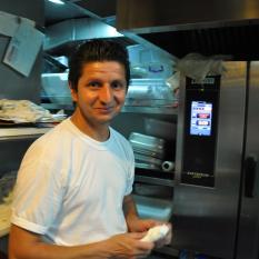 Recep oversees the operation and assists with the Turkish oven